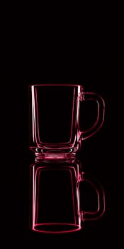 Just a glass on a black background with a reflection. Red colors. Isolated.