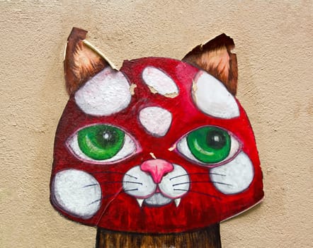 Cat collage street art in a street of Paris (France).