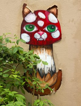 Cat collage street art in a street of Paris (France).