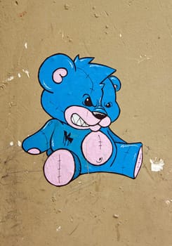 Blue bear, street art collage in a street of Paris (France).