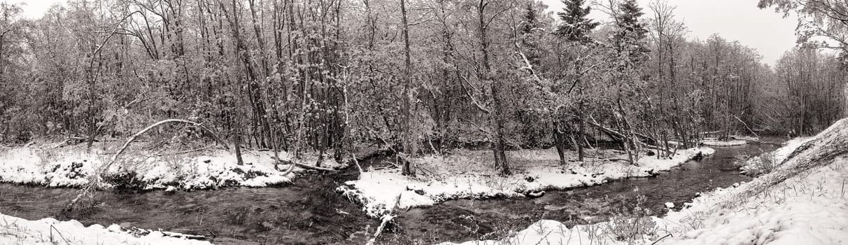Brook during snowfall in spring, Norway
