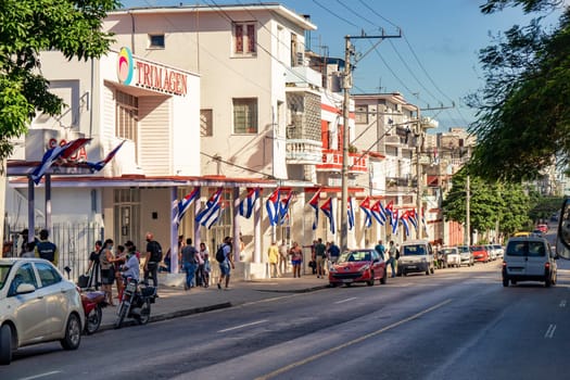 Havana Cuba. November 25, 2020: Trimagen Company on Ayestaran Avenue, decorated with various Cuban flags.