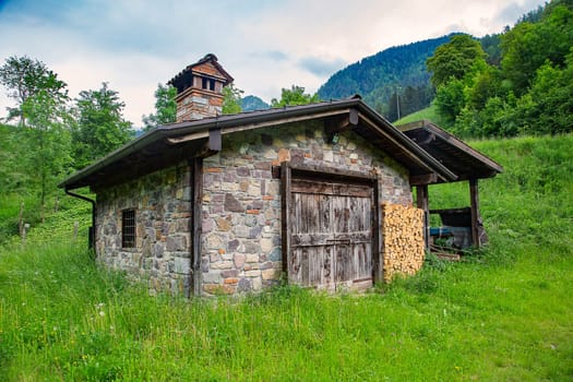 Old stone house in the mountains of Val Sabbia, province of Brescia, in upper Val Trompia, in Lombardy, Italy.