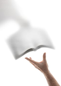 Human hand receiving the word of God brought by a heavenly messenger