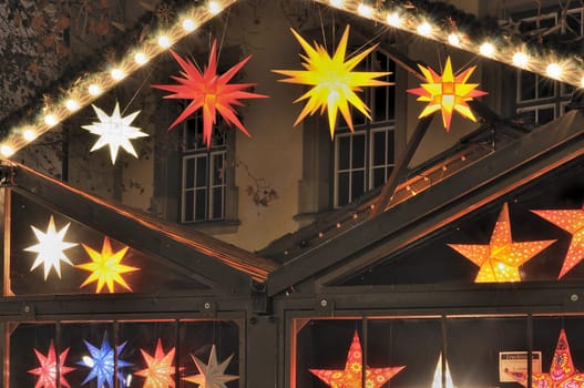 detail, at night, of traditional Christmas market held every Advent in streets and squares of city center ..