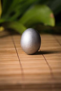 Silver Easter eggs with wood background