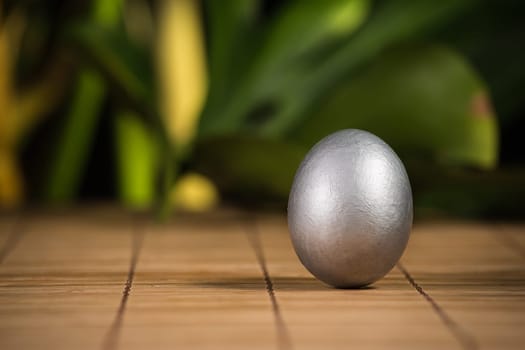 Silver Easter eggs with wood background