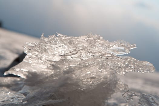 Close-up of cracked ice texture on river in spring time