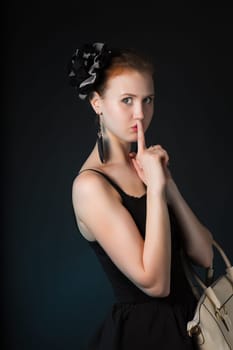Pretty young woman with big white bag standing posing