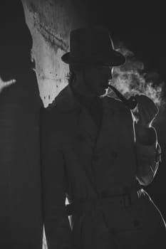 Black and white old-fashioned portrait of man with cigar