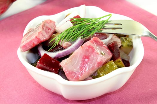 Matjessalat with beetroot,onions and sour cucumber