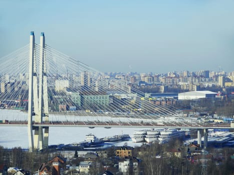 St. Petersburg in the winter, foreground  cobweb of cables, cable-stayed bridge and a pier, aerial view