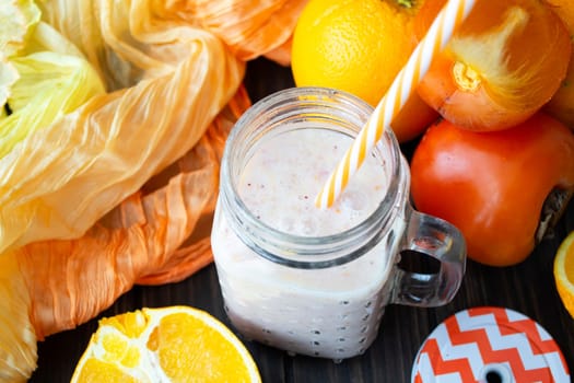 Smoothie banana orange cocktail with fresh oranges decoration