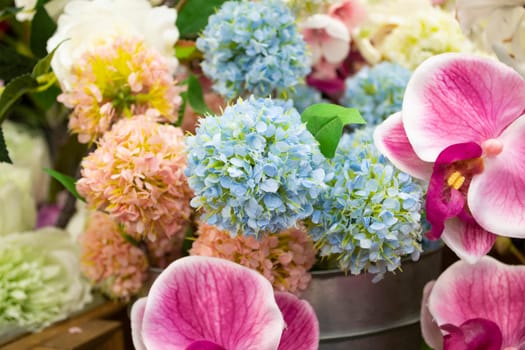 Colorful vintage decoration artificial flower near sunlight close up