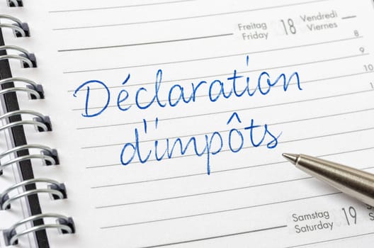 Daily planner with the entry Tax reporting in french - Déclaration d'impôt