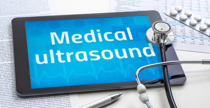 The word Medical ultrasound on the display of a tablet