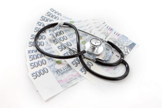 Czech paper money with heart on white background - stethoscope, heart, czech money 5000 and 1000