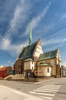 PARDUBICE, CZECH REPUBLIC - APRIL 22: St Bartholomew's Church of Republic Square on April 22 2016 in the historic center of the city. Church was built in the early 16th century. Summer day