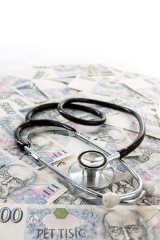 Czech paper money with heart on white background - stethoscope, heart, czech money 5000 and 1000
