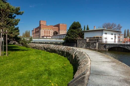 PARDUBICE, CZECH REPUBLIC - APRIL 22: Building Automatic mills Pardubice on April 22, 2016. An important monument of industrial architecture from 1910 by architect Josef Gocar. River Chrudimka.