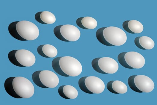 Some white eggs on a blue surface