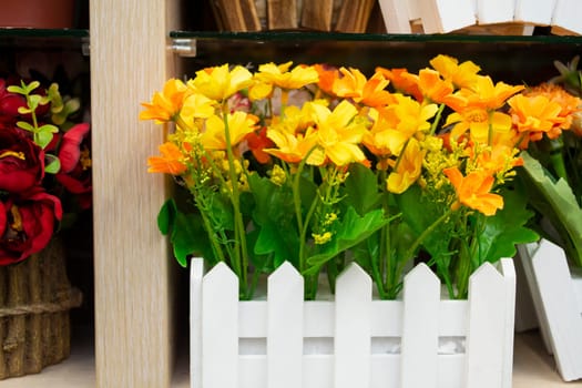 artificial yellow flowers in bouquet made from cloth, objest of interiors