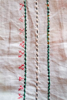 Embroidery pattern for background. Texture of the vintage homespun linen textile. Vertical image