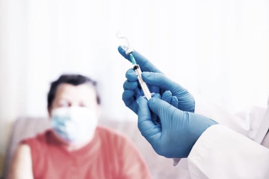 Elderly patient, being in risk group, receiving Covid-19 vaccine at home.