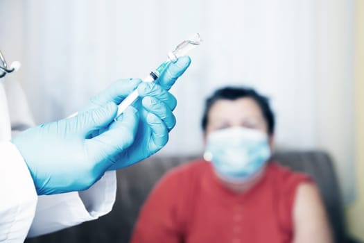 Elderly patient, being in risk group, receiving Covid-19 vaccine at home.