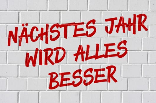 Graffiti on a brick wall - Next year everything will be better in german - Nächstes Jahr wird alles besser