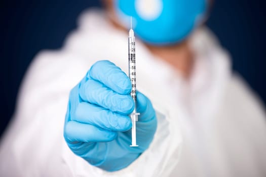 Concept of herd immunity, virus spreading in society. Doctor with syringe is preparing for vaccine.