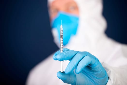 Concept of herd immunity, virus spreading in society. Doctor with syringe is preparing for vaccine.