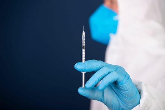 Concept of herd immunity, virus spreading in society. Doctor with syringe is preparing for vaccine.