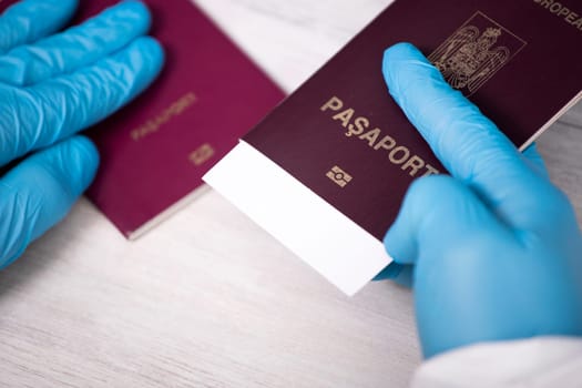 Doctor holding passport and negative covid-19 ( rapid antigen SARS-CoV-2 Ag ) test. Coronavirus and safety travel concept.