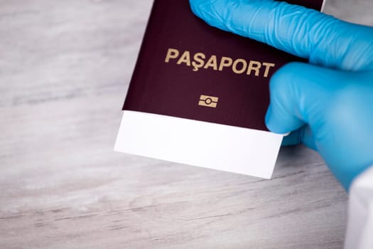 Doctor holding passport.  Immunity passport, risk-free certificate concept.