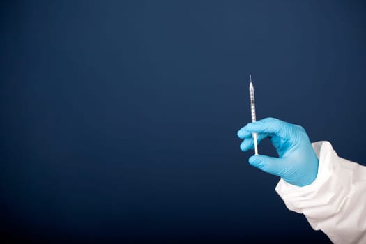 Concept of herd immunity, virus spreading in society. Doctor with syringe is preparing for vaccine.