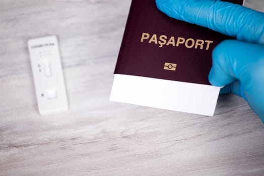 Doctor holding passport.  Immunity passport, risk-free certificate concept.