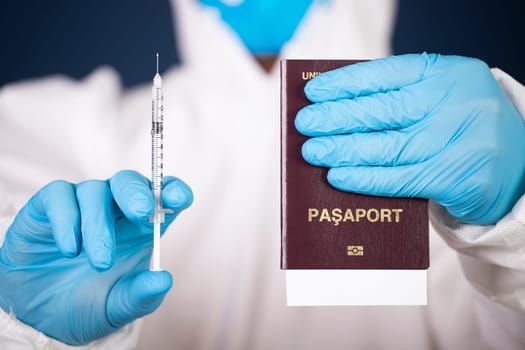 Doctor holding passport and vaccine. Immunity passport, risk-free certificate concept.