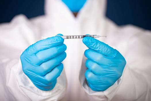 Concept of herd immunity, virus spreading in society. Doctor with syringe is preparing for vaccine.