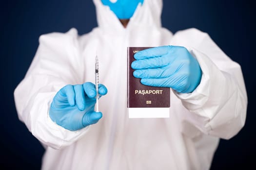 Doctor holding passport and vaccine. Immunity passport, risk-free certificate concept.