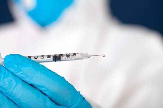 Concept of herd immunity, virus spreading in society. Doctor with syringe is preparing for vaccine.