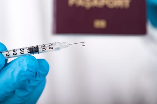 Doctor holding passport and vaccine. Immunity passport, risk-free certificate concept.