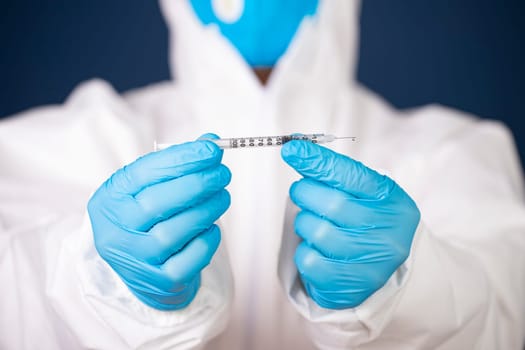 Concept of herd immunity, virus spreading in society. Doctor with syringe is preparing for vaccine.