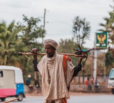 Adis Zemen, Ethiopia - April 22, 2019: Old ethiopian farmer on the street of Adis Zemen, Ethiopia, Africa