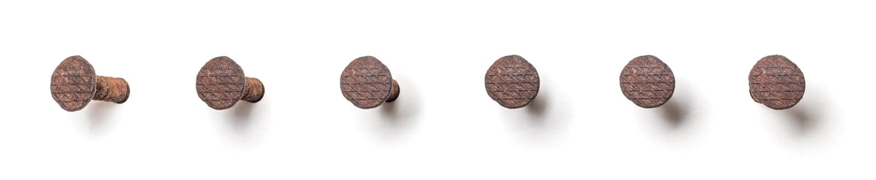 Rusty nail from different perspectives on a white background