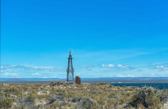 small lighthouse, beacon on the beach of Bahia Bustamante, Argentina