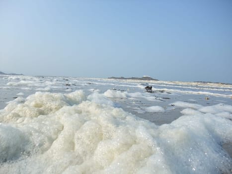 Foam made by the wave on the beach