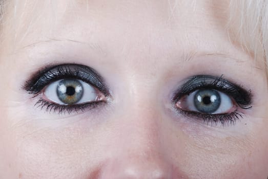 Close up the eyes of a young blond woman