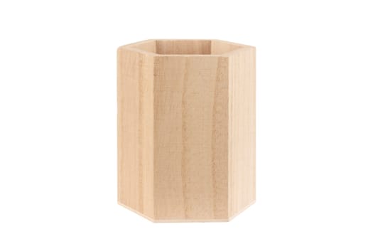 front view closeup of empty wooden hexagonal pencil desk holder isolated on white background