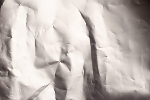 wrinkled silver aluminum foil background texture closeup